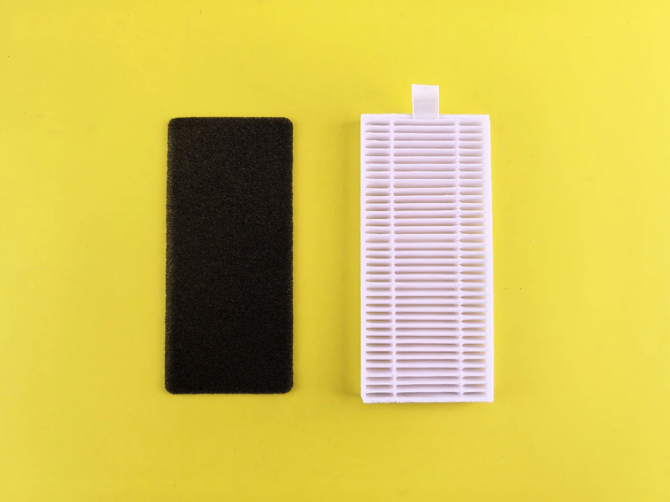 Foam pre-filter and pleated HEPA filter cartridge shown side by side