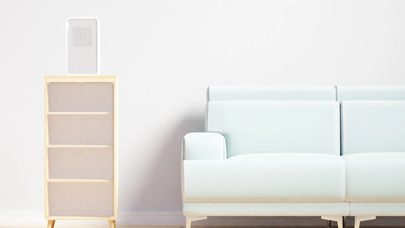 Air purifier tower standing in an empty, tidy living room