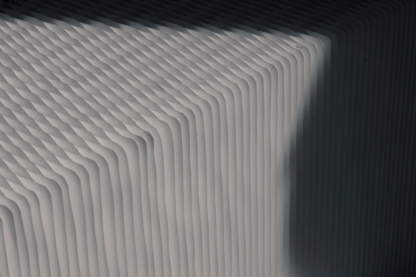 Close-up of white pleated HEPA filter media layers