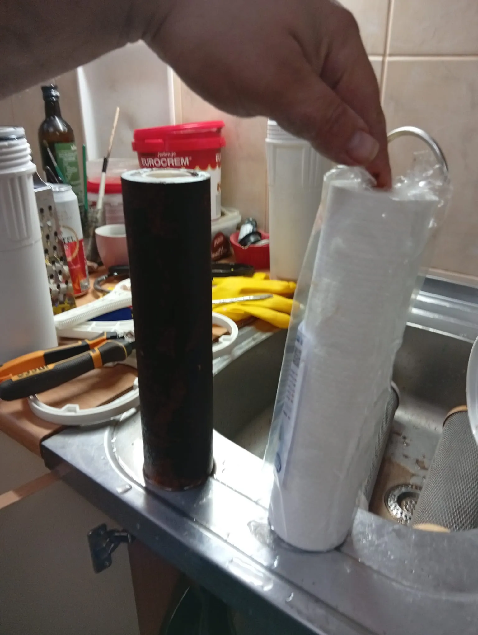 Reverse osmosis filter replaced after six months on the left, new filter on the right